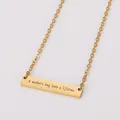 Detailed view of the 'A mother's hug lasts a lifetime' engraving on gold bar necklace - Creative Engraved Bar (Gold) / Gold