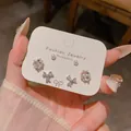 Conjunto de pendientes de plata S925 con circonitas y diseños de trébol y lazo - Juego de Trébol Lazo y Perla (E6881白K)