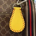 Miniature yellow faux leather baseball keychain bag charm with decorative red stitching - Softball Yellow