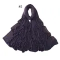 Detail view of purple jersey scarf with elegant gold bead stripe accents - 2