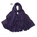 Detailed view of dark purple jersey scarf featuring parallel golden rhinestone borders - 4