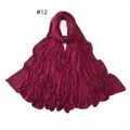 Detailed view of burgundy cotton scarf featuring golden rhinestone border and soft fabric - 12