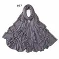 Detail of dark grey jersey scarf featuring parallel rows of brown sparkling rhinestones - 17