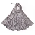 Detailed view of light grey jersey scarf featuring parallel rows of dark rhinestones - 19