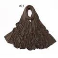 Detailed view of dark brown jersey scarf featuring delicate rhinestone edge embellishments - 31