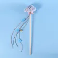 Plush cloud cat teaser wand with blue raindrops, bell, and wooden handle on blue background. - Cloud Cat Wand