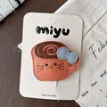 Cute cartoon leather hair clip in milk coffee color with a stylish blue bow accessory - Cat Coffee Cup