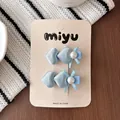 Barrettes à cheveux en satin bleu clair en forme de cœur avec perle et nœud décor - Style pince crocodile cœur bleu clair
