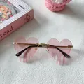 Trendy pink melting heart-shaped rimless sunglasses with Y2K aesthetic and gold temples - Pink 22-Heart Shape Dripping Fluid Rimless Style