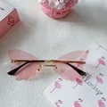 Y2K butterfly shaped rimless sunglasses with pink jelly lenses and gold frames - Pink 25-Butterfly Wing Rimless Gold Metal Pink Style