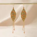 Elegant vintage golden leaf tassel earrings featuring orange rhinestones and beads - Antique Leaf Tassel Earrings