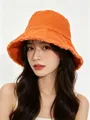 Vibrant orange bucket hat with frayed edges worn by an Asian woman model - M / Orange