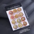 Macro view of 12-piece crystal flower brooches on a black display card and weight info - KC Gold Colorful Rhinestone Floral Style (KC Gold Color Diamond)