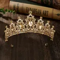Macro detail of golden baroque crown with champagne diamonds and pear-cut gemstones - Champagne