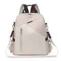 Close-up of beige nylon backpack featuring brown accents and detachable shoulder strap - Off White