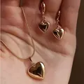 Elegant rose gold heart pendant necklace and hook earrings set for women - Resin Heart Style - Gold