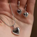 Polished silver heart-shaped jewelry set including snake chain necklace and stud earrings - Resin Heart Style - Silver