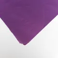 Close-up macro view of purple tissue paper showing fine texture and layered paper edges - Dark Purple