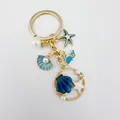 Portachiavi dorato stile marino con ciondoli a forma di conchiglia, stella e balena - Balena Conchiglia Blu Dorato (Q1538)