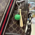 Green mini stitched leather baseball and wooden bat keychain accessory hanging on a bag - 2cm Green Ball 7.5cm Bat
