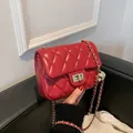 Elegant red quilted chain bag with golden ball detail and metal turn-lock closure - Red