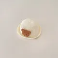 Breathable off-white baby straw sun hat featuring a cute plush bear decoration - Infant Size / Bear / White