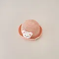 Adorable pink woven baby sun hat featuring a soft white plush bear patch detail - Infant Size / Bear / Pink