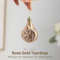 Roségoldener Weihnachts-Wassertropfen-Anhänger mit Glitzer und goldener Schnur - Roségold Wassertropfen