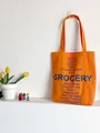 Retro Segeltuch-Einkaufstasche in Orange mit kontrastierendem blauem Text-Aufdruck - Orange