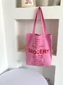 Pink canvas tote bag with bold red Grocery and vegetable text print design - Rose Red