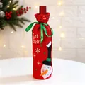 Detailed view of a red Christmas wine bottle cover with snowman design and green ribbon - Sequined Red Cover - Snowman / Red