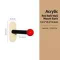 Modern minimalist acrylic wall hook featuring a black arm and red ball decorative tip - Wood Acrylic Red Ball Wall Hook