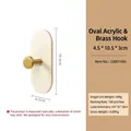 Elegant oval acrylic and brass wall hook for coats and hats in modern minimalist style - Oval Acrylic Brass Hook