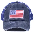 Distressed navy blue trucker hat with USA flag embroidery and white star mesh pattern - Flag Cyan