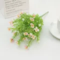 Detail of pink and white silk jasmine bouquet in a ceramic dish on white table - Pink