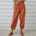 Casual burnt orange cotton linen wide-leg cropped trousers with drawstring and button details. - Brick Red