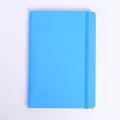 Minimalist blue A5 notebook featuring a premium faux leather cover and elastic closure - Sky Blue