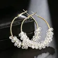 Detailed view of elegant large gold hoop earrings with clear faceted crystal beads - Wire-Wrapped Crystal Bead Large Hoop (E2545 White) / 925 Silver Needle / Gold/White