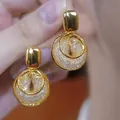 Elegant gold-plated round hoop earrings featuring a sparkling zircon pavé mesh center design - Double Layer Disc Zirconia Filled (E2453 Gold) / 925 Silver Needle / Gold