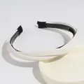 Elegant white twisted headband with non-slip inner teeth for secure daily hair styling - White