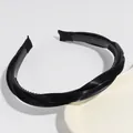 Minimalist black twisted headband with anti-slip teeth for comfortable daily hair styling - Black