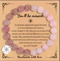 Pink rose quartz and rhodonite beaded bracelet with a silver compass charm for graduation gifts. - Rosewood Grain Rose Quartz Message Style (With Card)