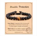 Handmade black lava stone and tiger eye bead adjustable woven bracelet on display card - Lava Stone Tiger Eye Braided Style (With Card)