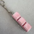 Pink 3-key mechanical keycap fidget toy keychain for stress relief on grey fabric - Three Keys Transparent Shell - Pink (Double Layer)