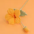 Detailed handmade orange crochet hibiscus flower with green stem and leaf on peach background - Orange - Meng Si Trumpet Creeper Branch