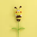 Handmade crochet bumblebee on green stem, cute yellow and brown knitted flower gift - Flying Bee Flower Branch / Yellow