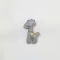 Detail shot of a cute gray leather giraffe charm with gold chain accessory for bags - Giraffe Charm / Gray