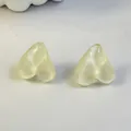 Macro detail of translucent light yellow heart-shaped candy style stud earrings - Creamy White (32439-ear-white-EP)
