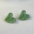 Detailed macro view showing the translucent candy-colored green heart stud earrings - Candy Green (32439-ear-dark green-EP)