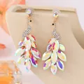 Exotic peacock-shaped earrings featuring iridescent crystals and rhinestones in gold - AB White (Glass)